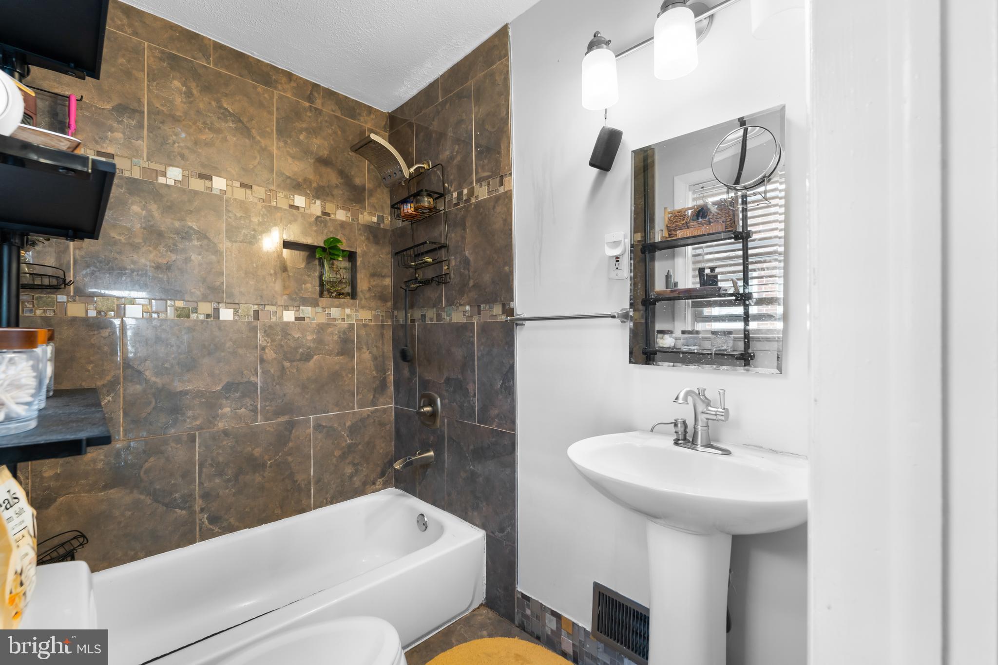 1420 V Street Southeast Washington, DC 20020 - Photo 19 of 29 a bathroom with a sink toilet and shower