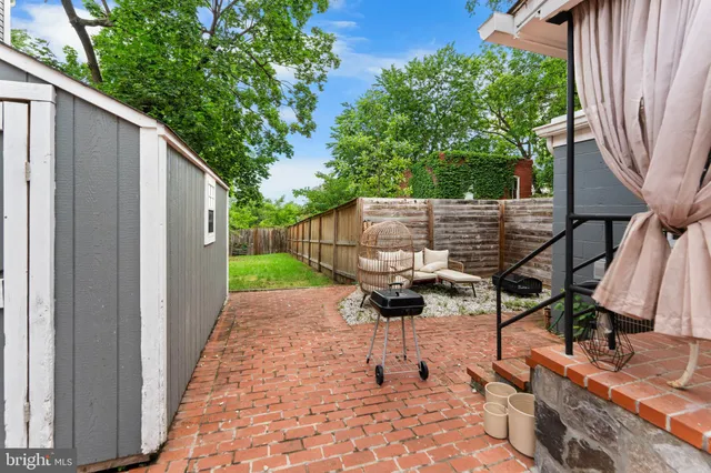 a view of backyard with a patio