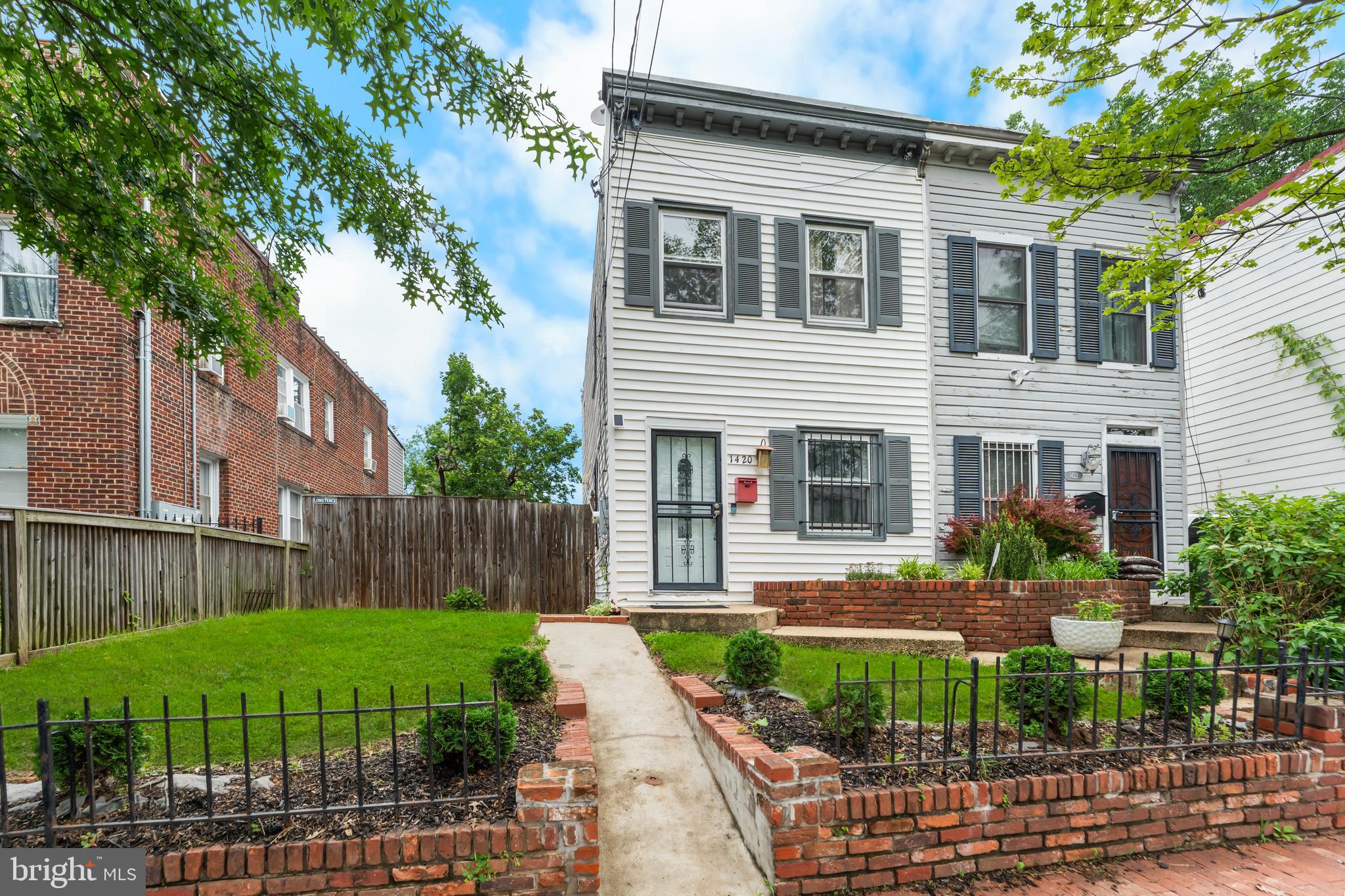 1420 V Street Southeast Washington, DC 20020 - Photo 3 of 29 a front view of a house with garden