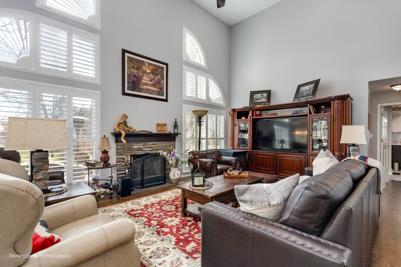2219 Barrett Drive Algonquin, IL 60102 - Photo 15 of 55 a living room with furniture a fireplace and a flat screen tv