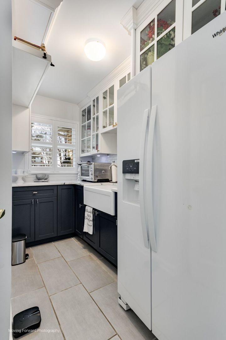 2219 Barrett Drive Algonquin, IL 60102 - Photo 21 of 55 a kitchen with stainless steel appliances granite countertop a refrigerator and a sink