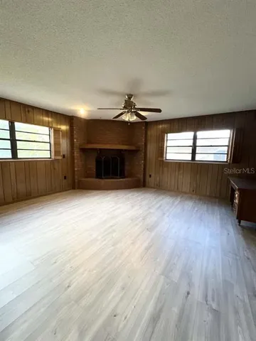 a view of a room with gym equipment and a large window