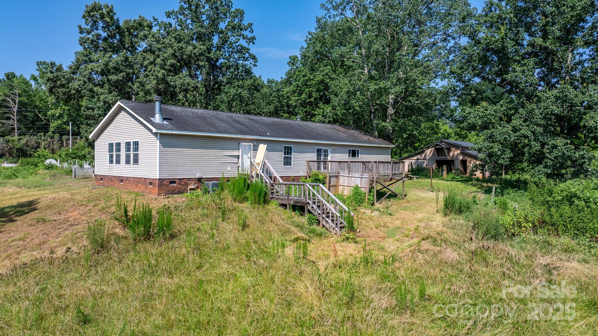 6314 Providence Church Road Vale, NC 28168 - Photo 14 of 39 a house view with a garden space