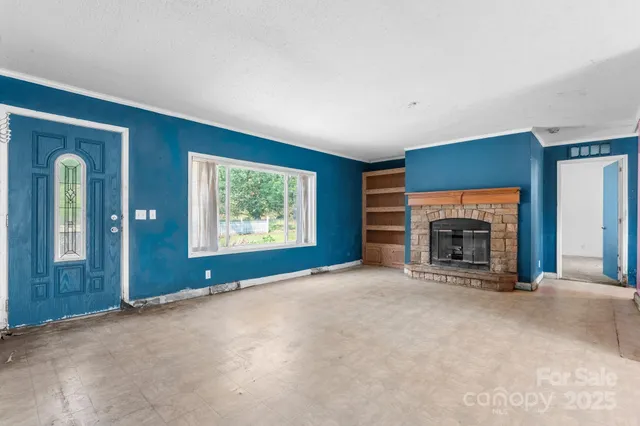 a view of a kitchen with granite countertop a sink and dishwasher a oven with granite countertops