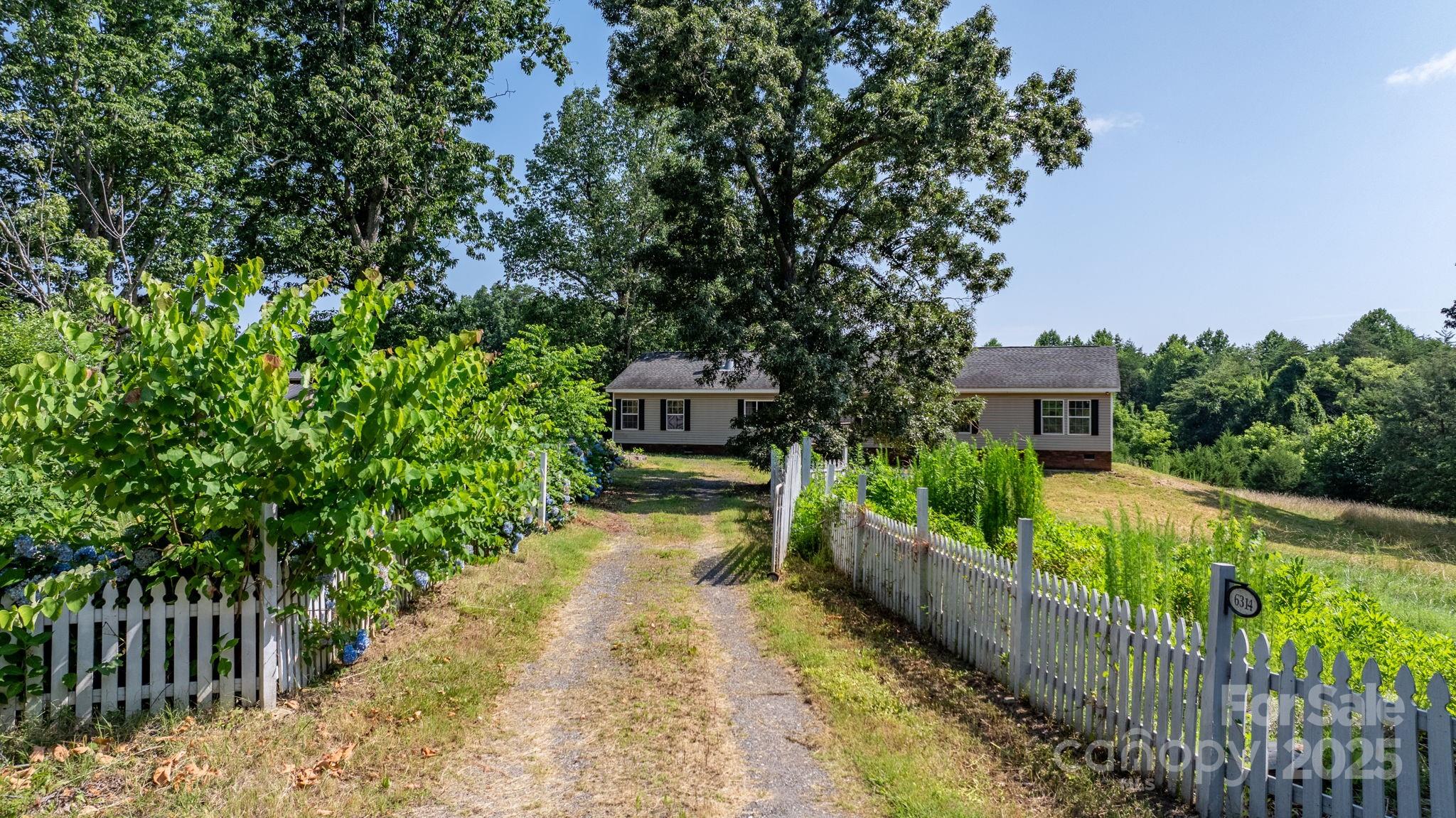 6314 Providence Church Road Vale, NC 28168 - Photo 2 of 39 a view of a house with wooden fence