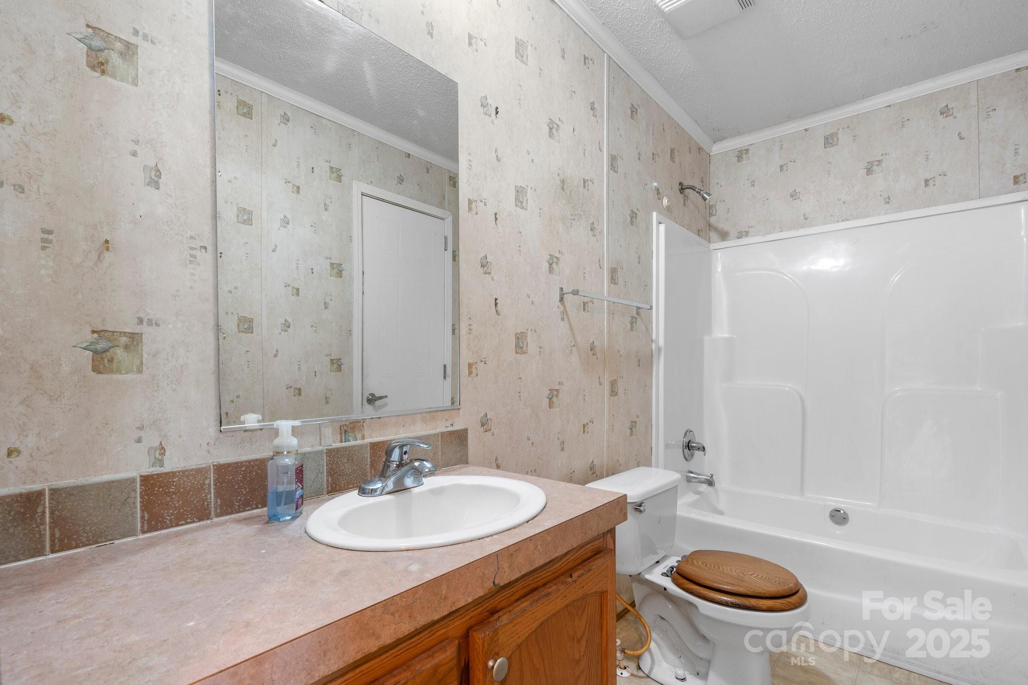 6314 Providence Church Road Vale, NC 28168 - Photo 28 of 39 a bathroom with a sink a toilet and shower