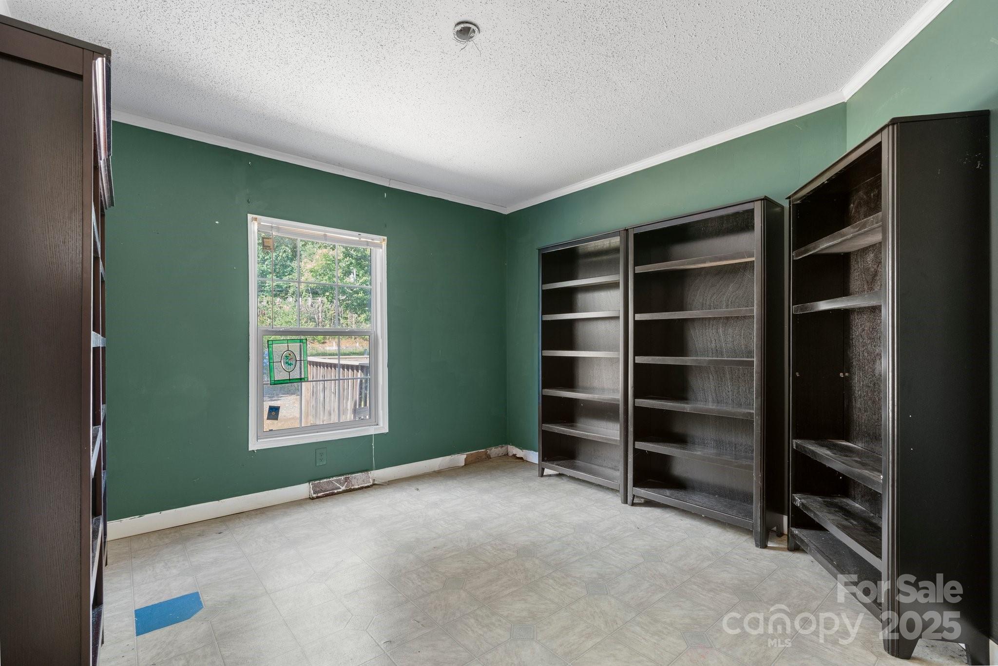 6314 Providence Church Road Vale, NC 28168 - Photo 29 of 39 a view of an empty room with a fireplace and a window