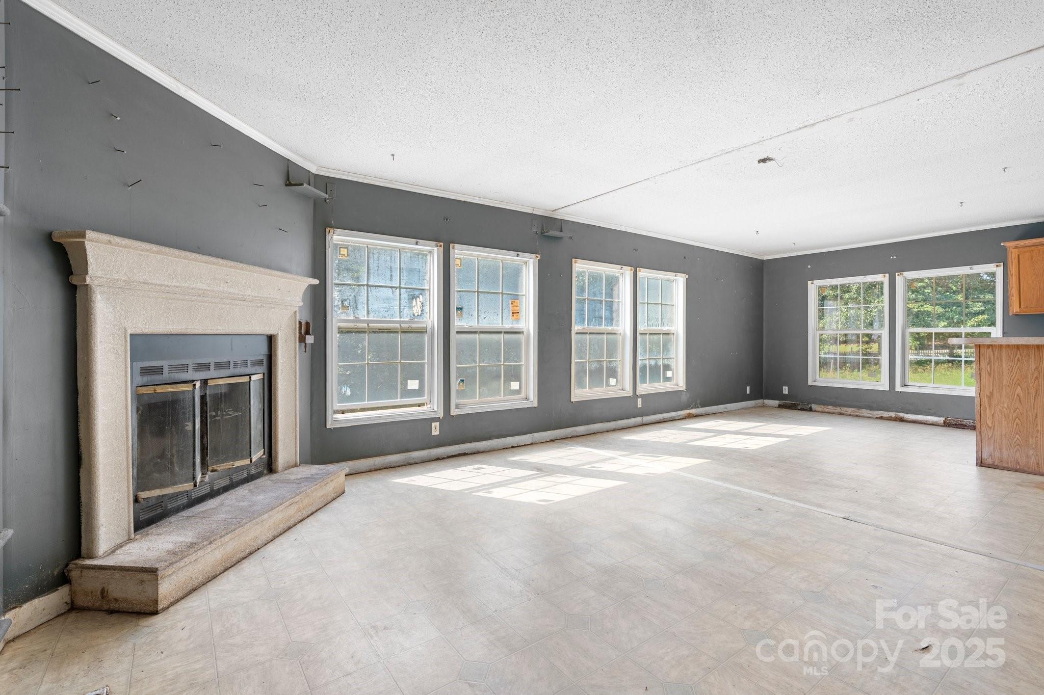 6314 Providence Church Road Vale, NC 28168 - Photo 33 of 39 a view of an empty room with a fireplace and a large window