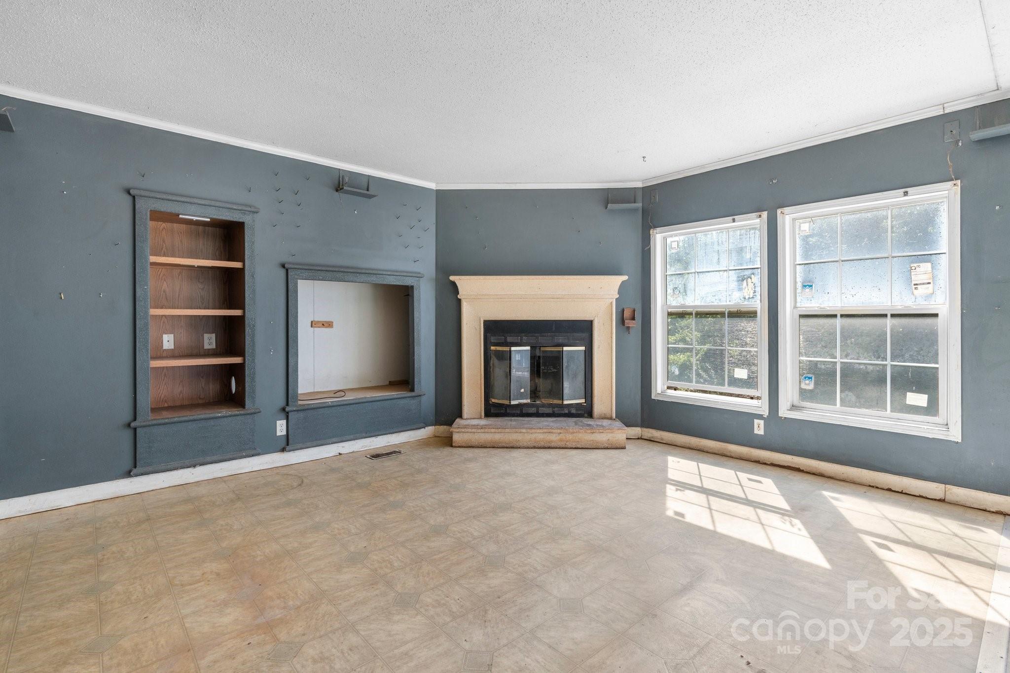 6314 Providence Church Road Vale, NC 28168 - Photo 34 of 39 a view of an empty room with a fireplace and a window