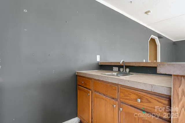 an aerial view of a house with a yard and outdoor seating