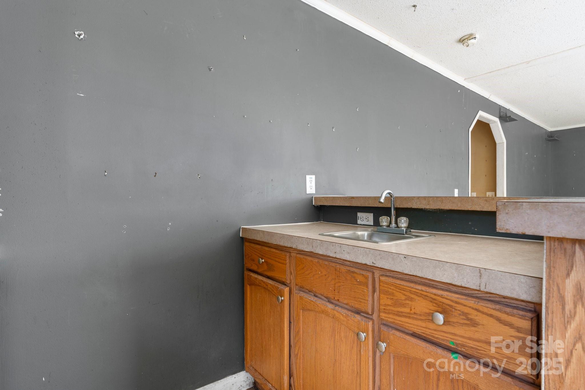 6314 Providence Church Road Vale, NC 28168 - Photo 37 of 39 a bathroom with a granite countertop sink and a mirror