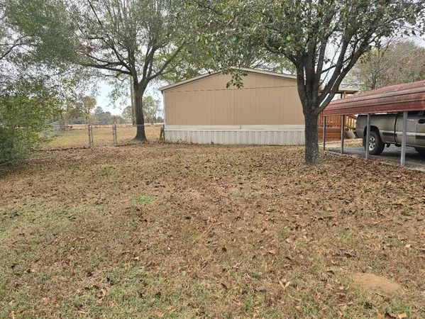 a house view with a backyard space