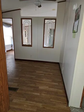 a view of an entryway with wooden floor