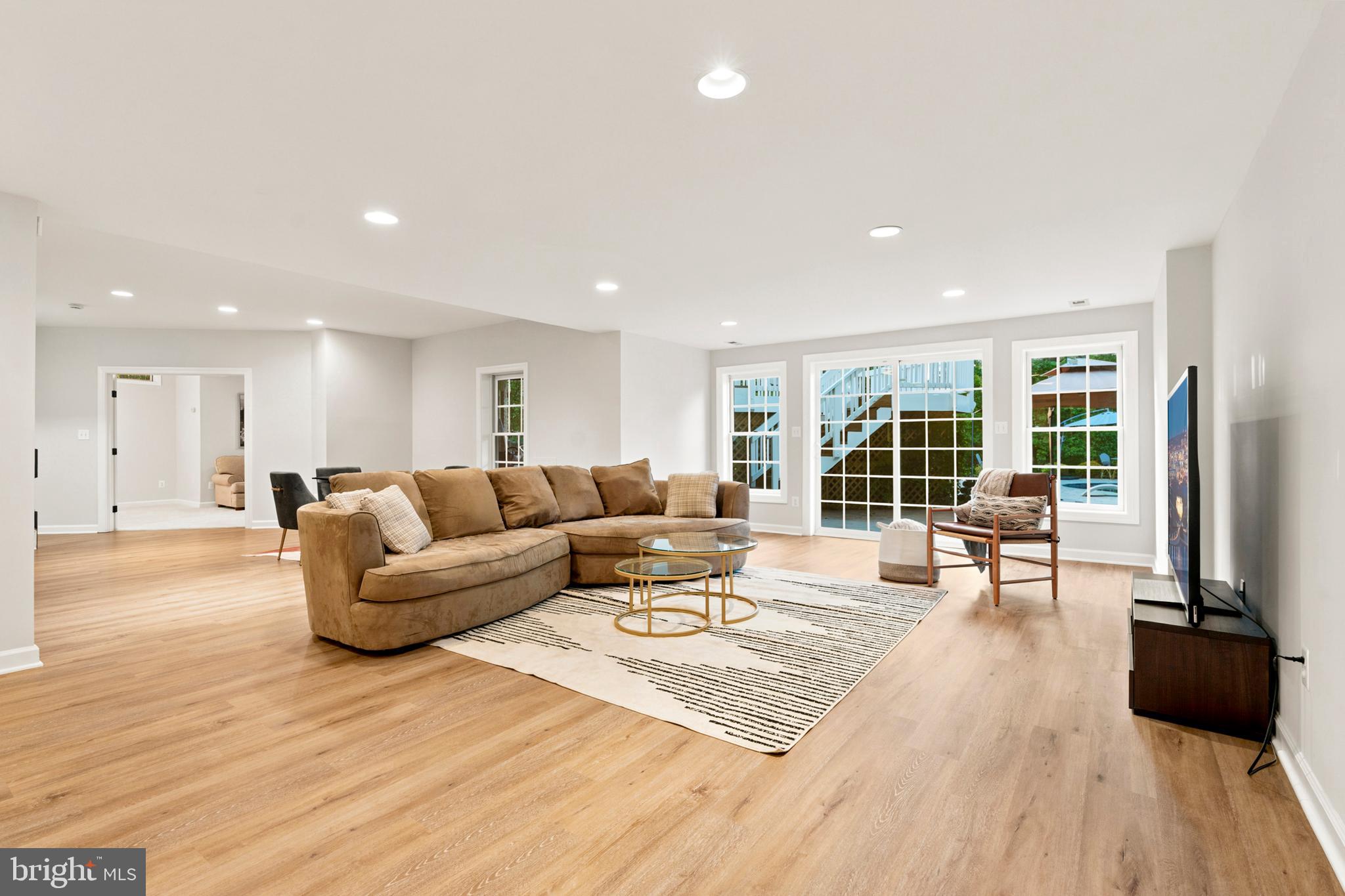 9313 Harrisons Farm Way Laytonsville, MD 20882 - Photo 53 of 77 a living room with furniture and a large window
