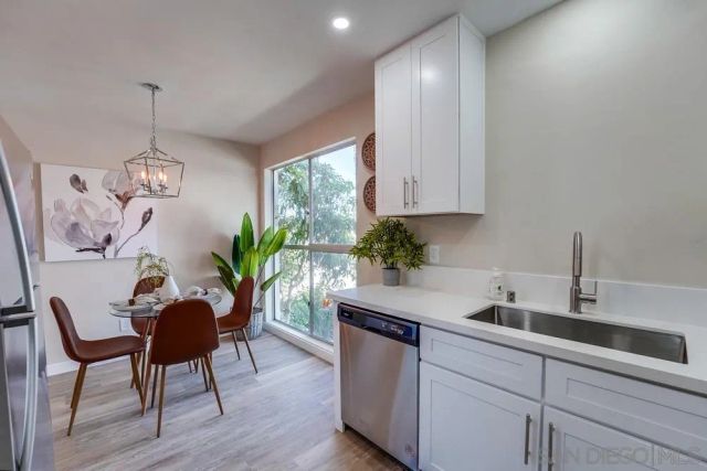 a kitchen with a table and chairs in it