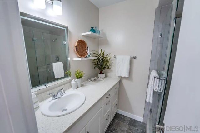 a bathroom with a sink and a mirror