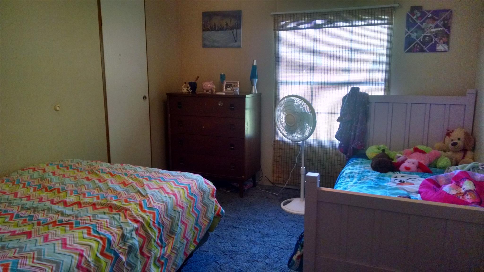 8647 Richards Road Lyles, TN 37098 - Photo 27 of 29 a bedroom with a bed and a dresser