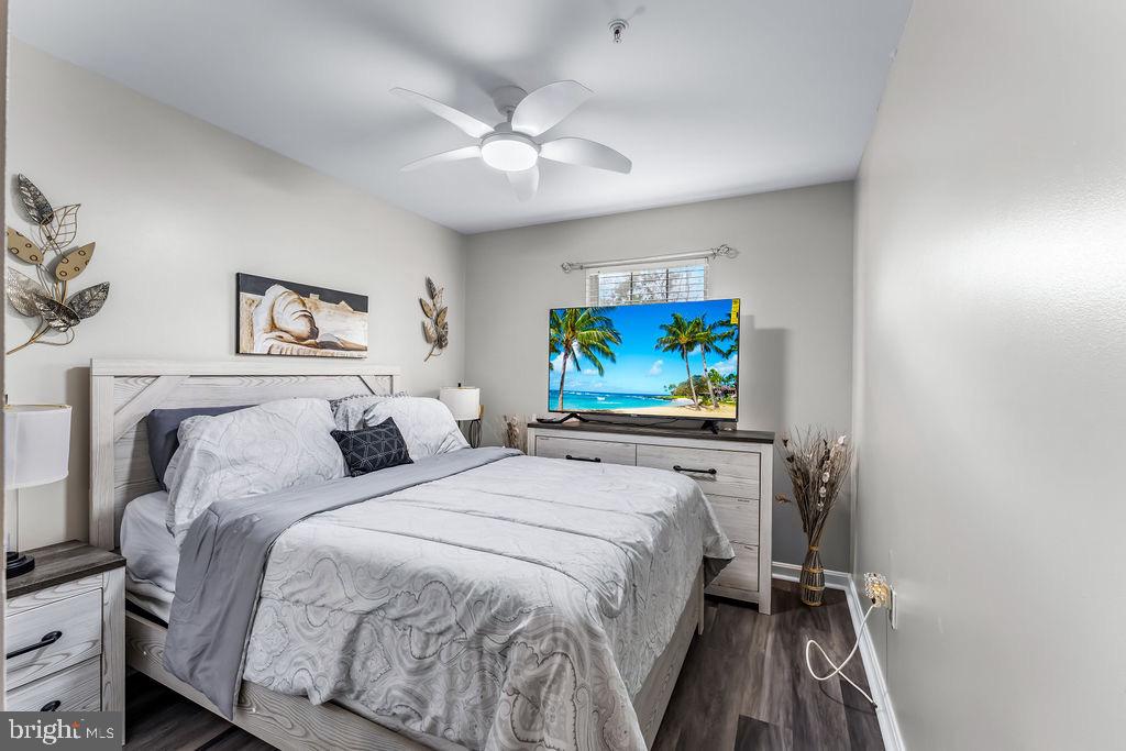 11409 Hermosa Drive Laurel, MD 20708 - Photo 20 of 28 a bedroom with a bed and a flat screen tv