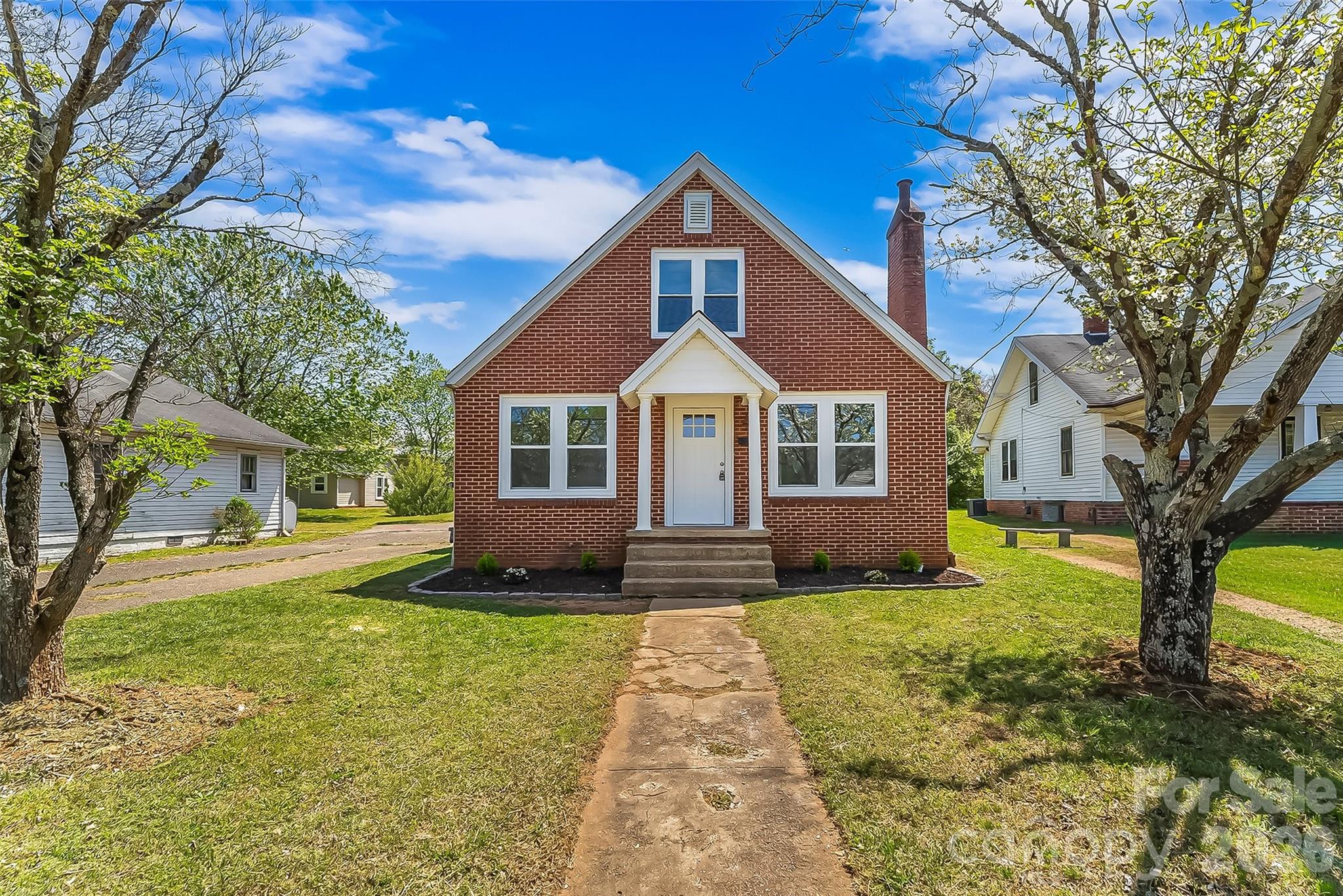608 East Concord Street Morganton, NC 28655 - Photo 1 of 23 a front view of a house with a yard