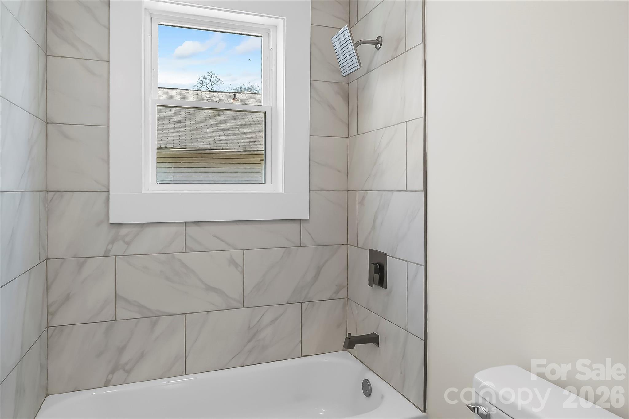 608 East Concord Street Morganton, NC 28655 - Photo 12 of 23 a bathroom with a bathtub