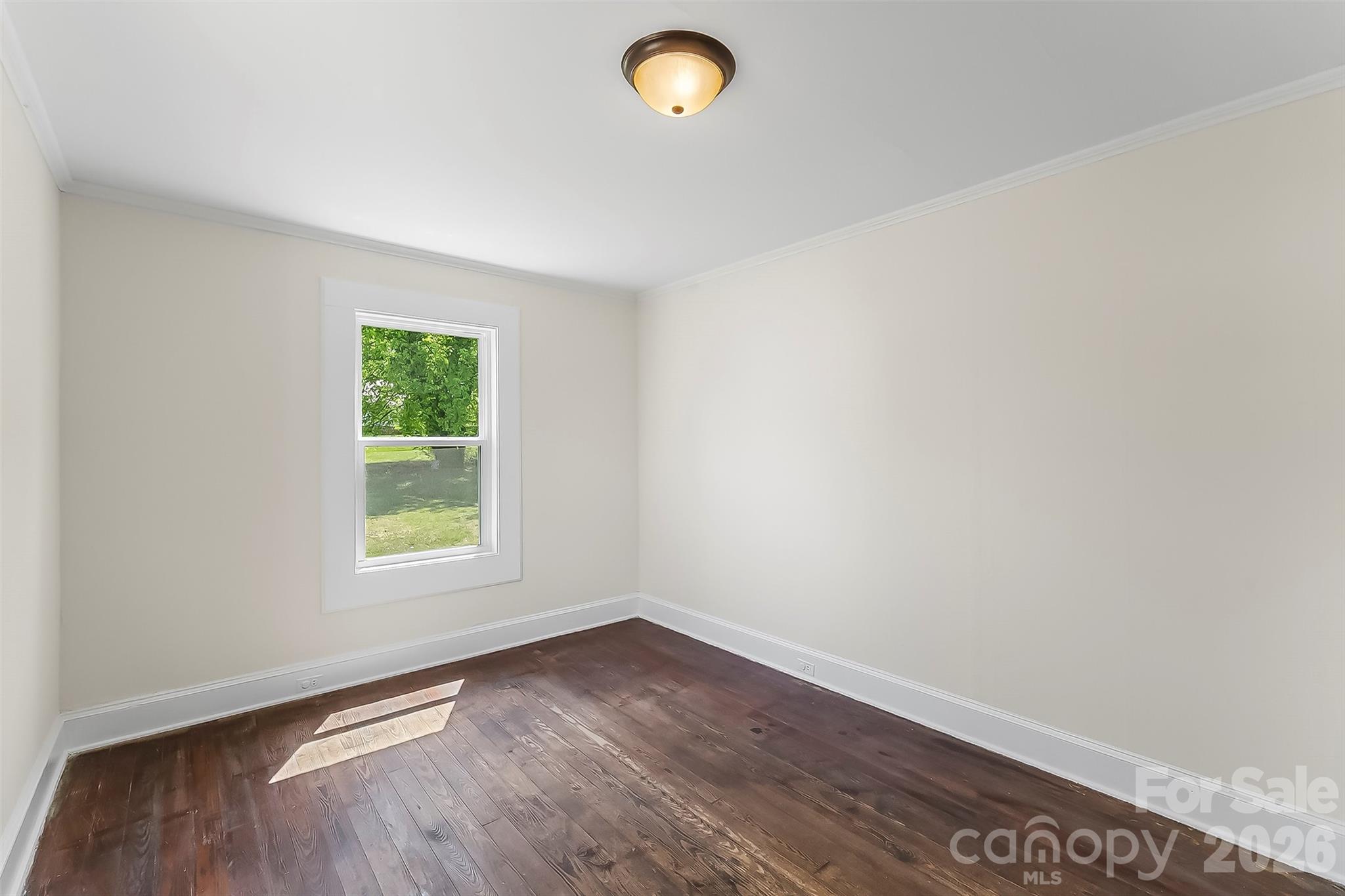 608 East Concord Street Morganton, NC 28655 - Photo 18 of 23 an empty room with a window