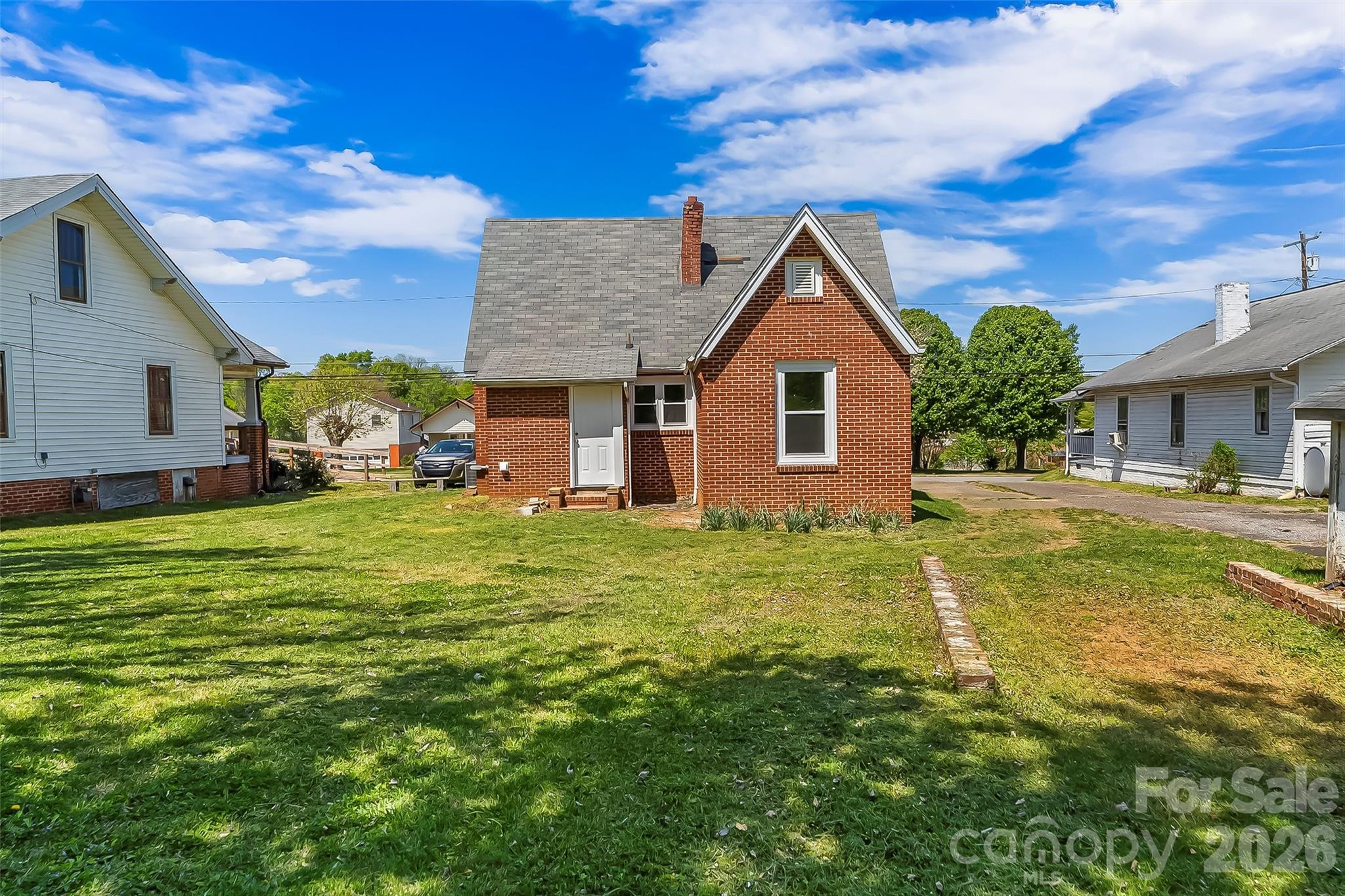 608 East Concord Street Morganton, NC 28655 - Photo 20 of 23 a front view of a house with a garden