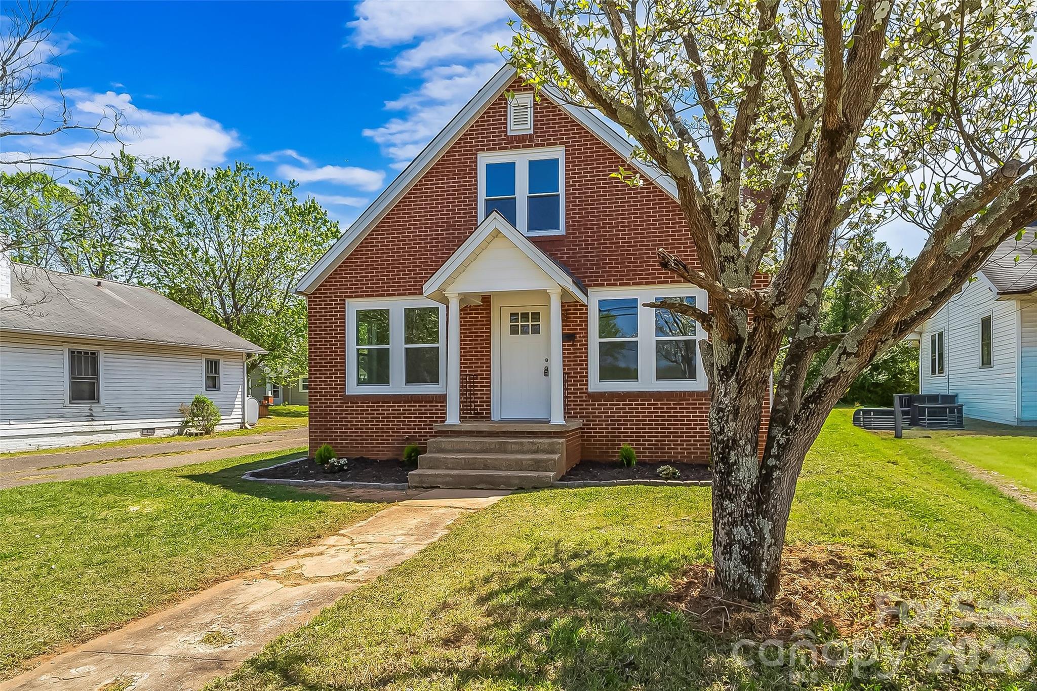 608 East Concord Street Morganton, NC 28655 - Photo 2 of 23 a front view of a house with a yard