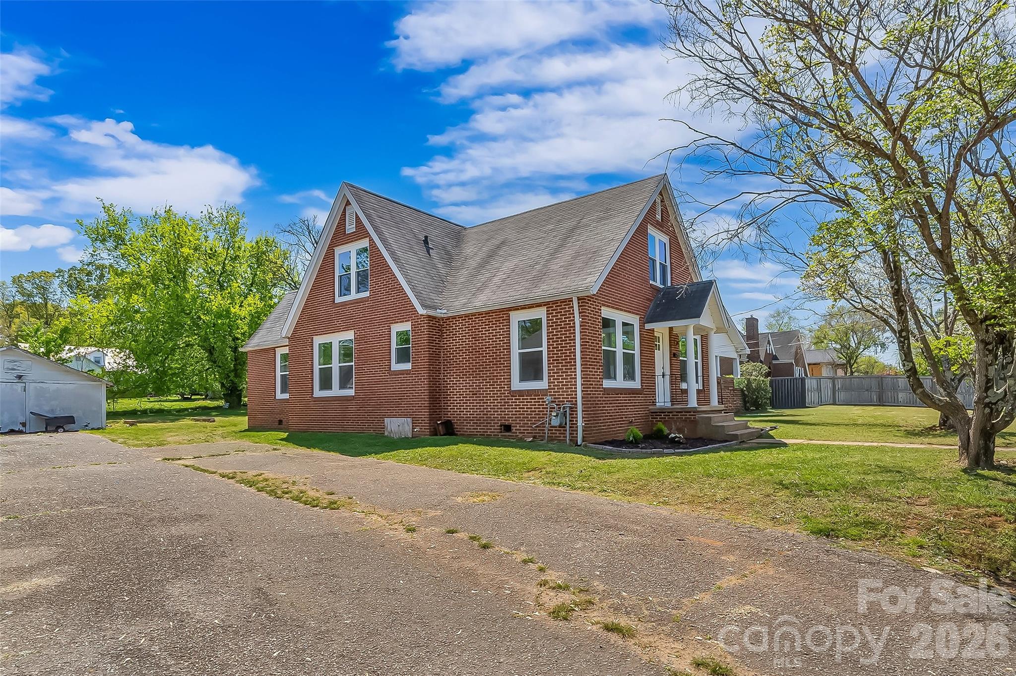 608 East Concord Street Morganton, NC 28655 - Photo 21 of 23 a front view of a house with a yard and garage