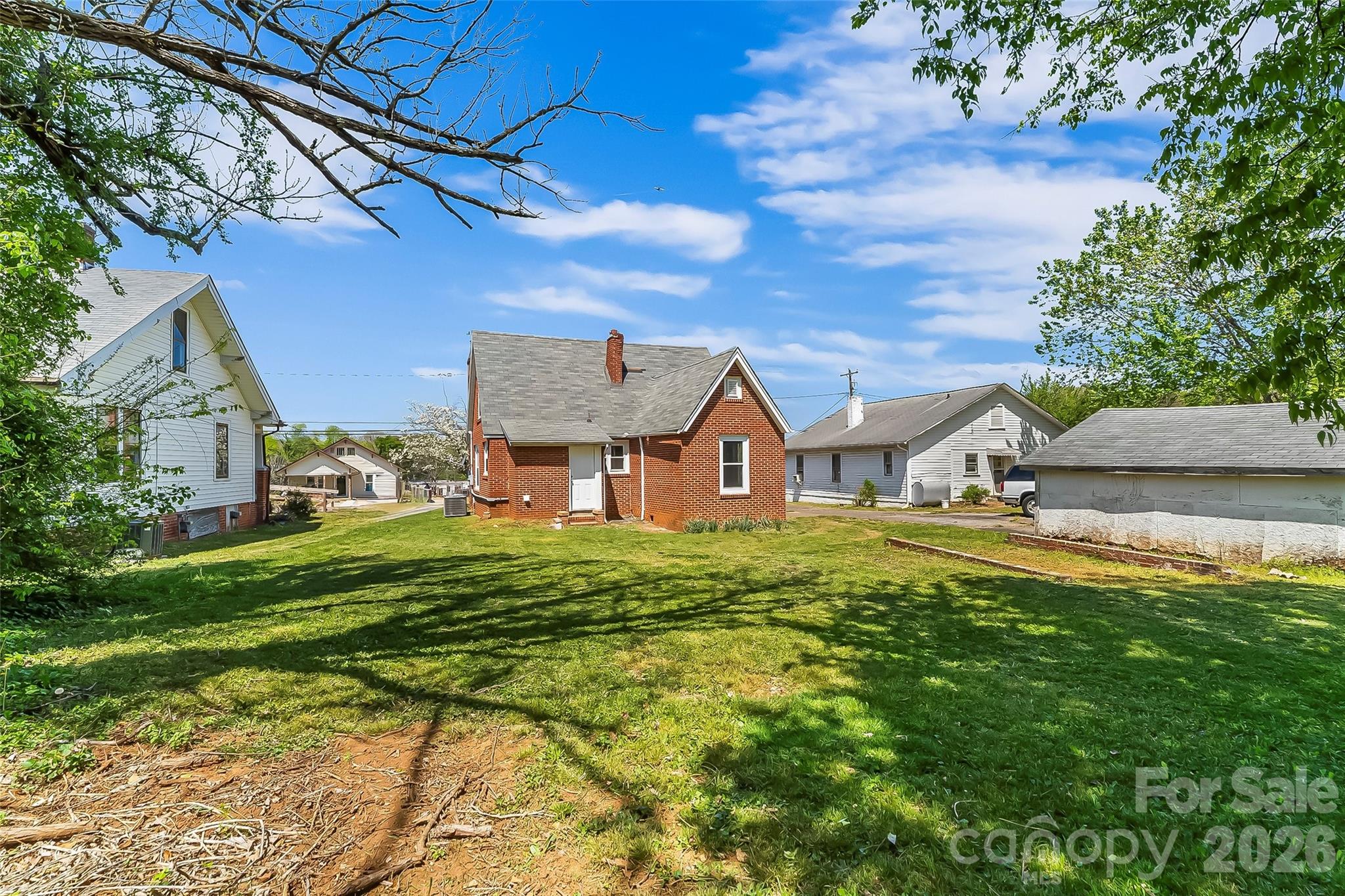 608 East Concord Street Morganton, NC 28655 - Photo 22 of 23 a aerial view of a house with a yard table and chairs