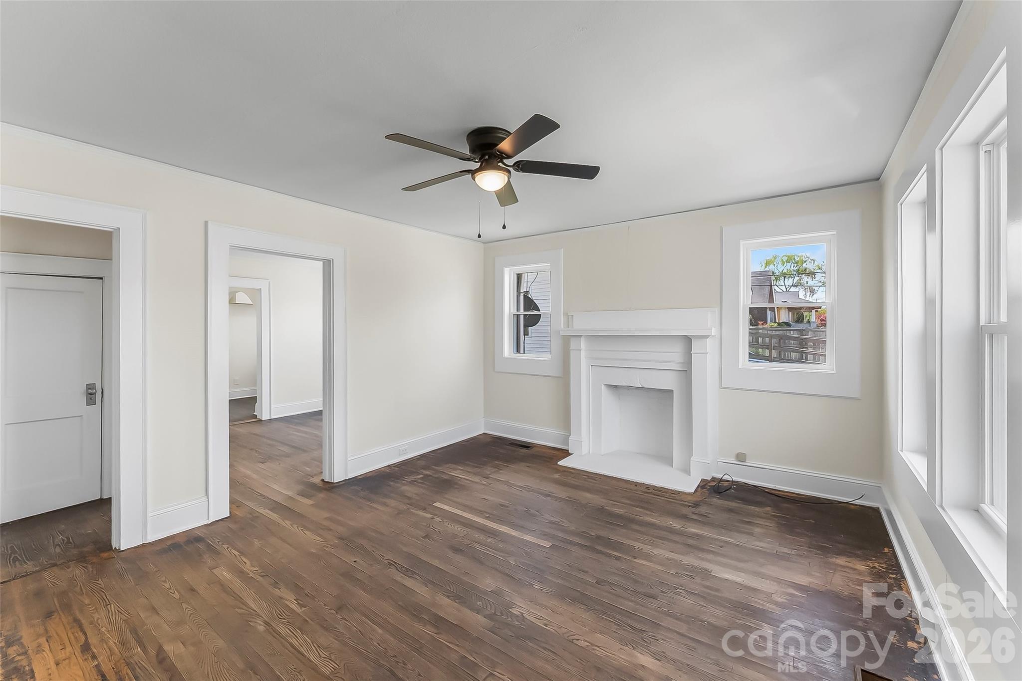 608 East Concord Street Morganton, NC 28655 - Photo 3 of 23 wooden floor in an empty room with a window