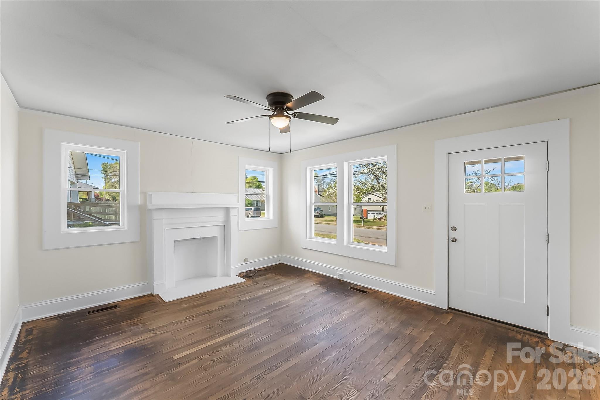 608 East Concord Street Morganton, NC 28655 - Photo 4 of 23 a view of an empty room with a window and a kitchen