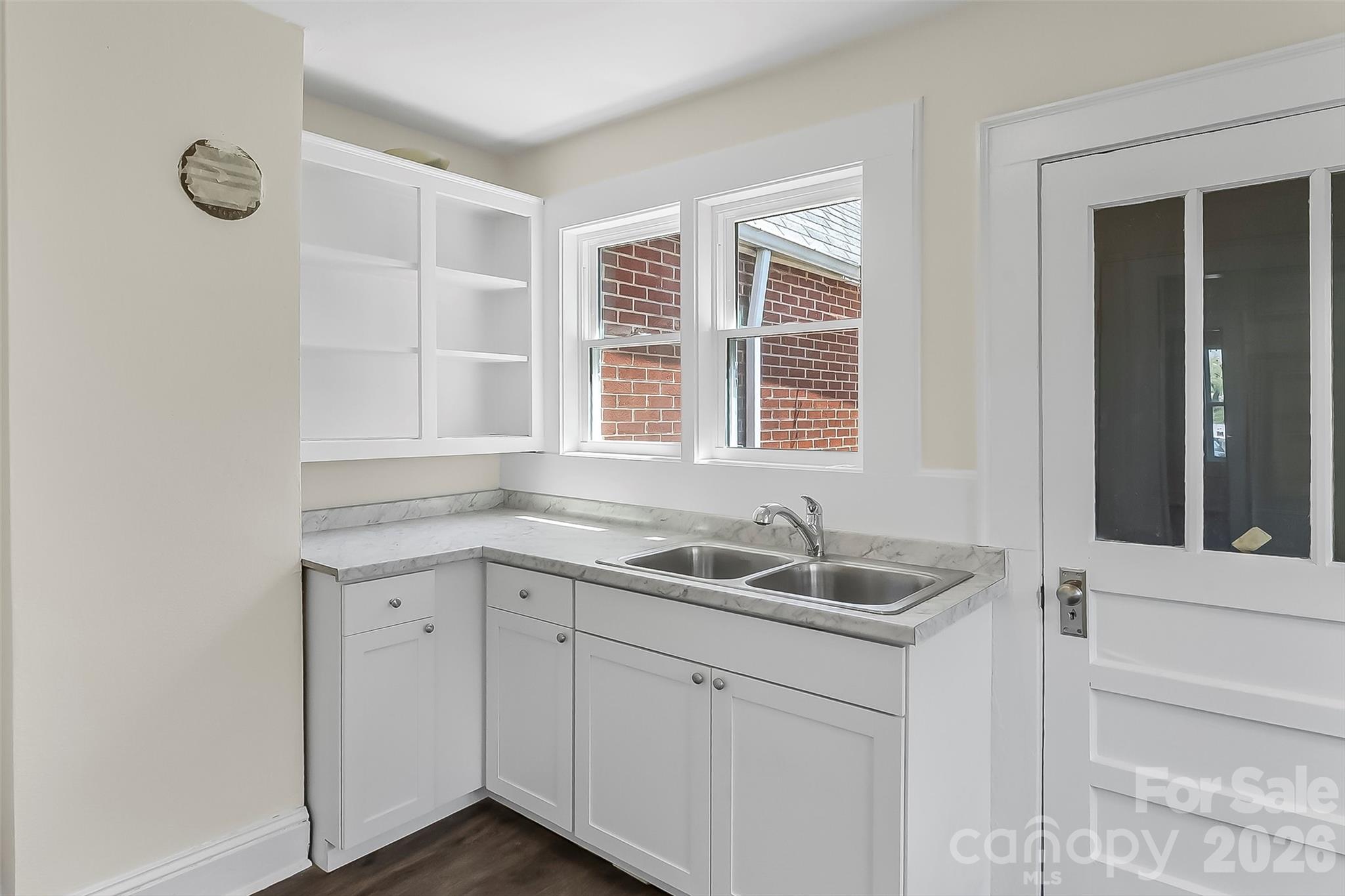 608 East Concord Street Morganton, NC 28655 - Photo 8 of 23 a kitchen with a sink and cabinets