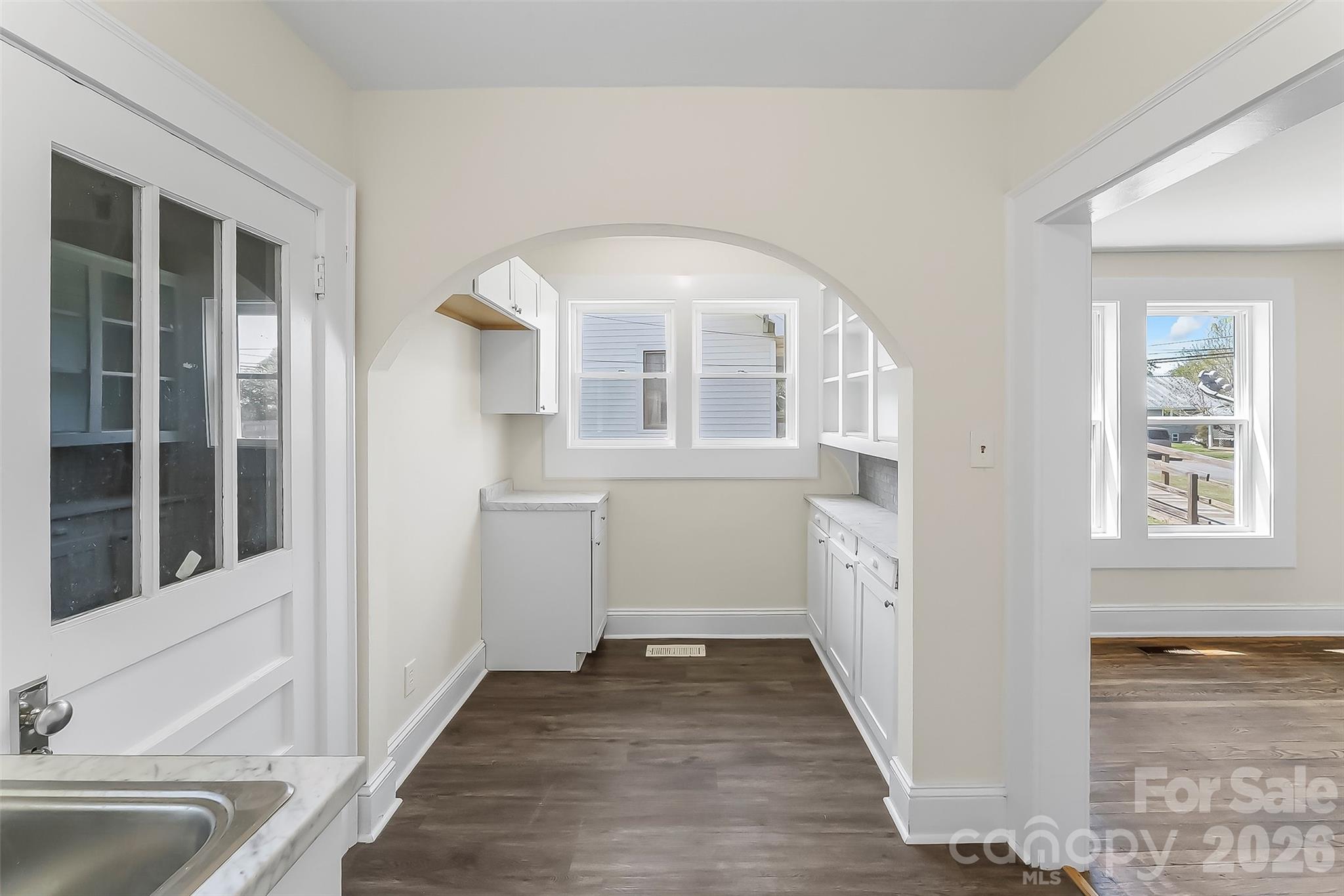 608 East Concord Street Morganton, NC 28655 - Photo 9 of 23 a view of a hallway with a sink and a window