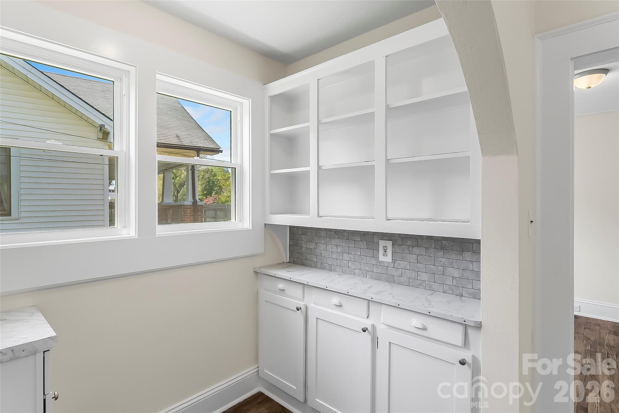 608 East Concord Street Morganton, NC 28655 - Photo 10 of 23 a room with granite countertop cabinets and window