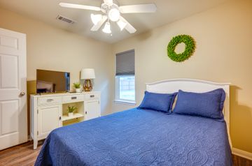 2105 Granite Ridge Place Bryan, TX 77801 - Photo 18 of 23 a bedroom with a bed and a chandelier