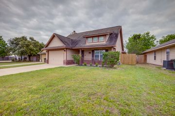 2105 Granite Ridge Place Bryan, TX 77801 - Photo 2 of 23 a front view of a house with a garden
