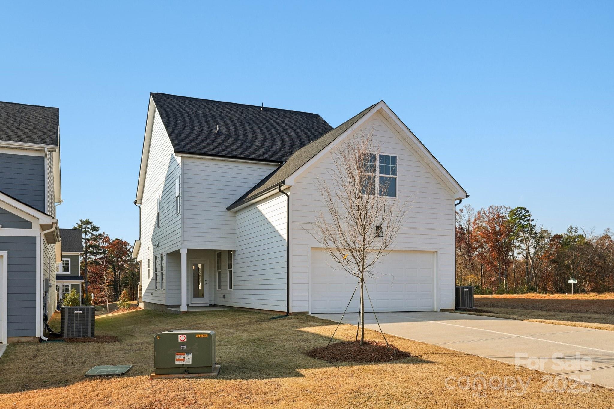 9612 Pointer Road, Unit 59 Huntersville, NC 28078 - Photo 43 of 43 a front view of a house with a yard