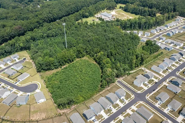 an aerial view of residential house with outdoor space