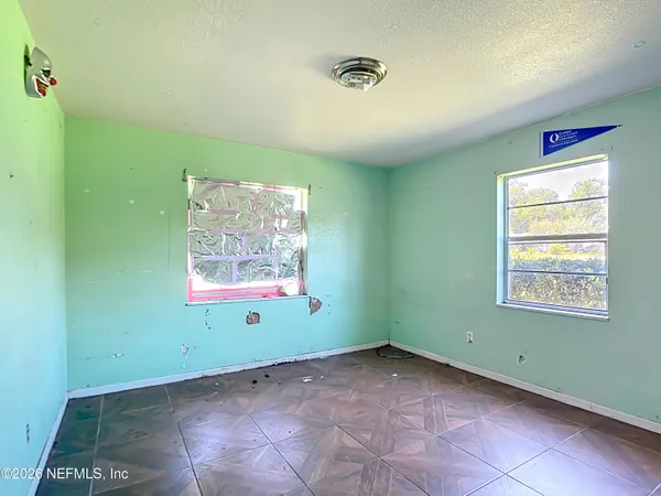 a view of an empty room and window