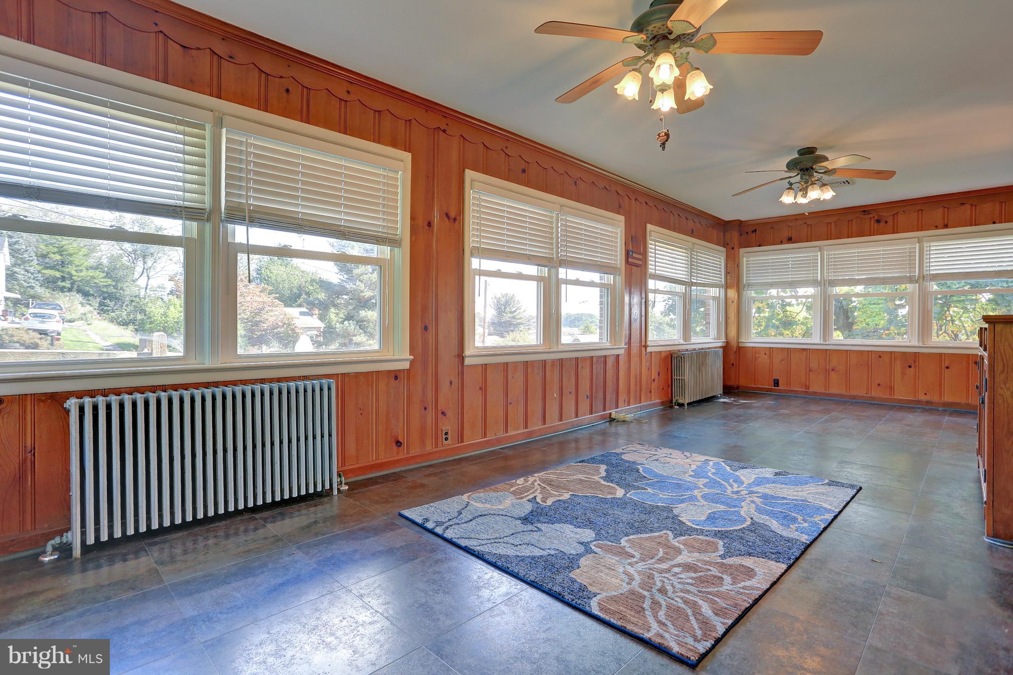 425 Corbin Road York, PA 17403 - Photo 15 of 49 a view of a big room with wooden floor and windows