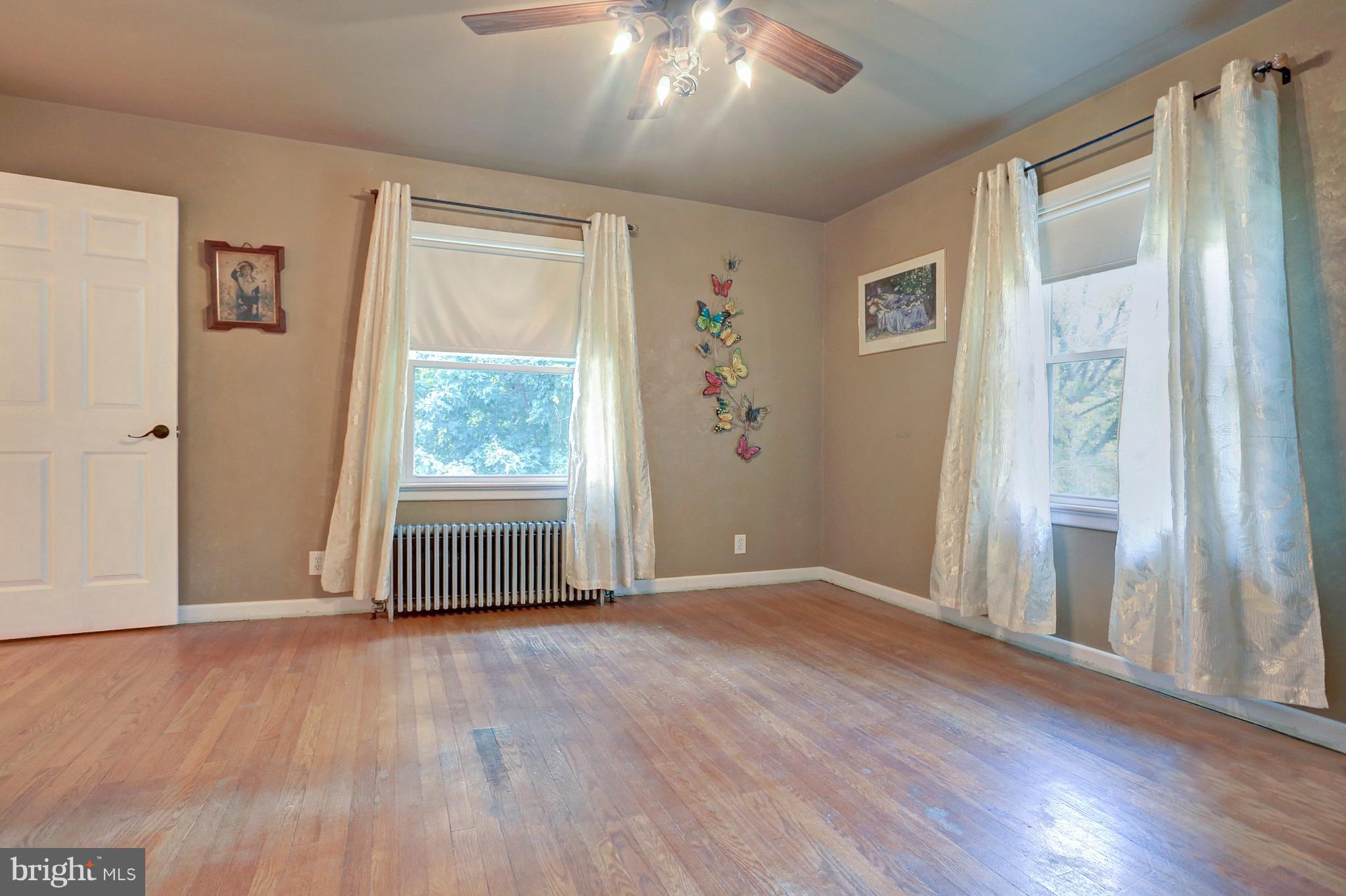425 Corbin Road York, PA 17403 - Photo 19 of 49 wooden floor in an empty room with a window
