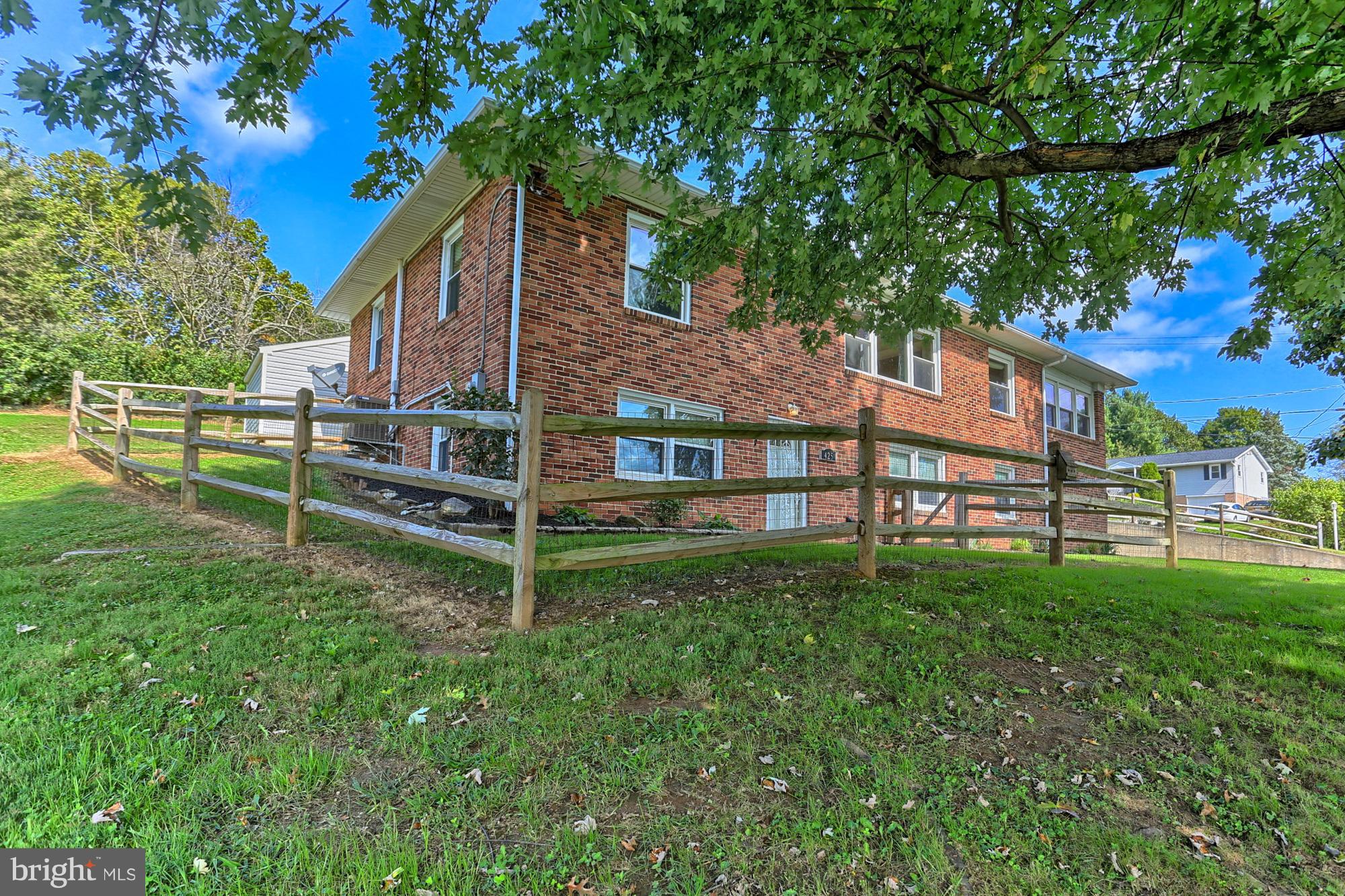 425 Corbin Road York, PA 17403 - Photo 3 of 49 a view of a house with a yard