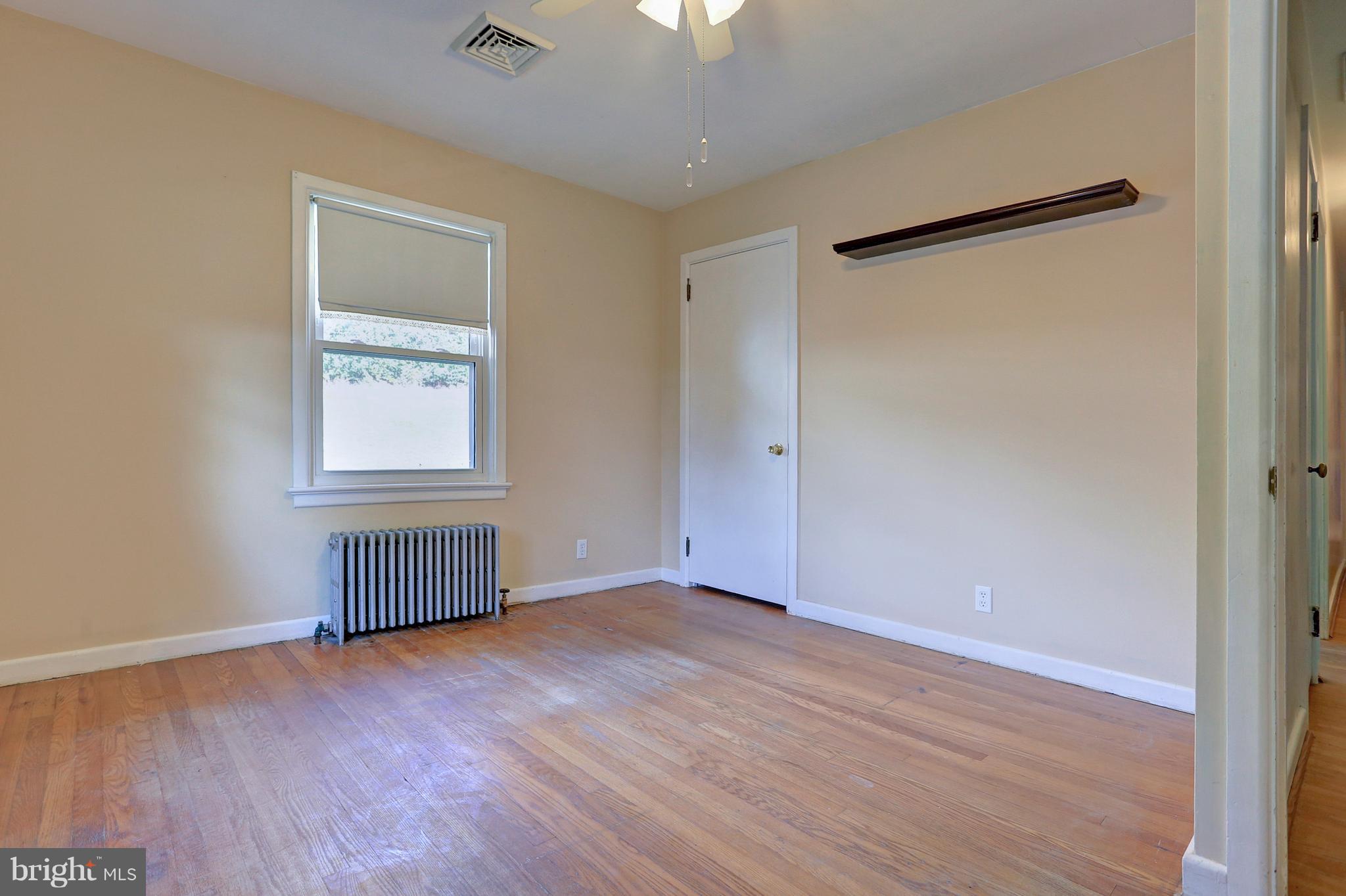 425 Corbin Road York, PA 17403 - Photo 24 of 49 an empty room with wooden floor and windows