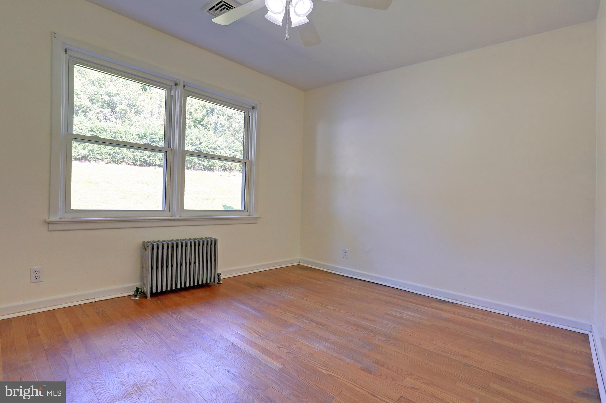 425 Corbin Road York, PA 17403 - Photo 26 of 49 an empty room with wooden floor and windows