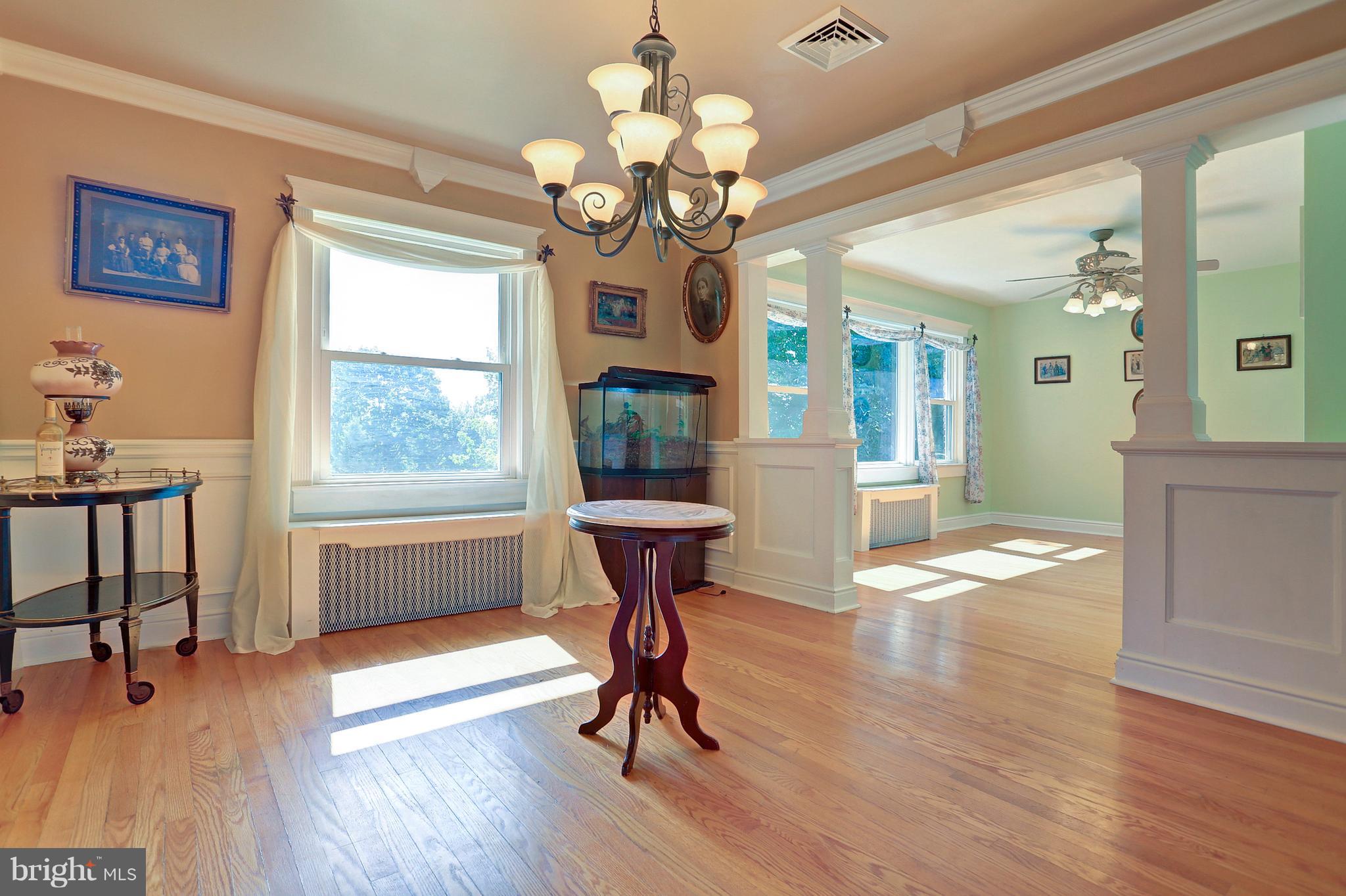425 Corbin Road York, PA 17403 - Photo 4 of 49 a view of a livingroom with furniture a chandelier and wooden floor