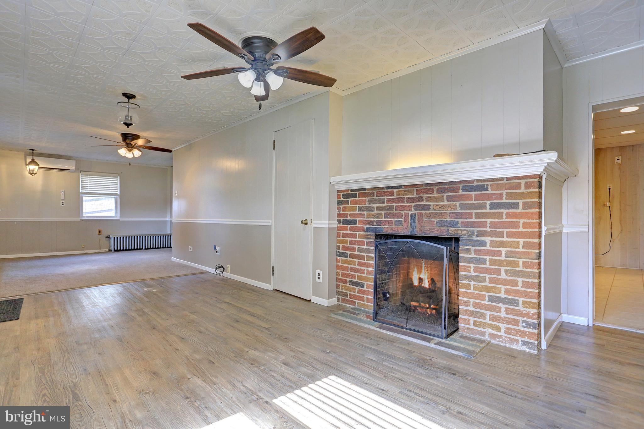 425 Corbin Road York, PA 17403 - Photo 31 of 49 a view of a livingroom with a fireplace and wooden floor