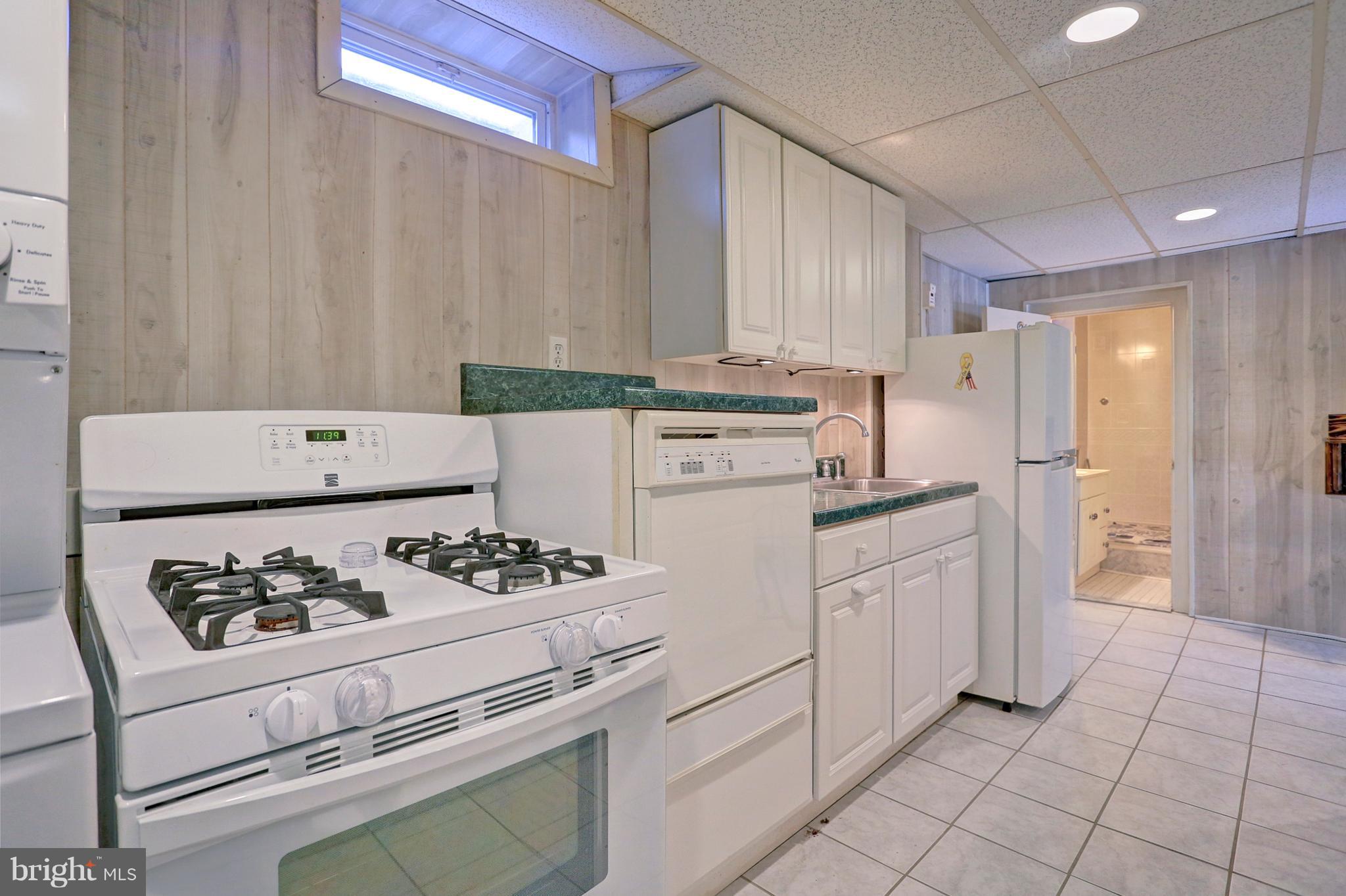 425 Corbin Road York, PA 17403 - Photo 39 of 49 a kitchen with appliances a stove and a refrigerator
