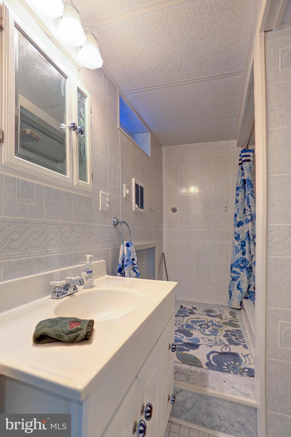 425 Corbin Road York, PA 17403 - Photo 40 of 49 a bathroom with a sink and a mirror