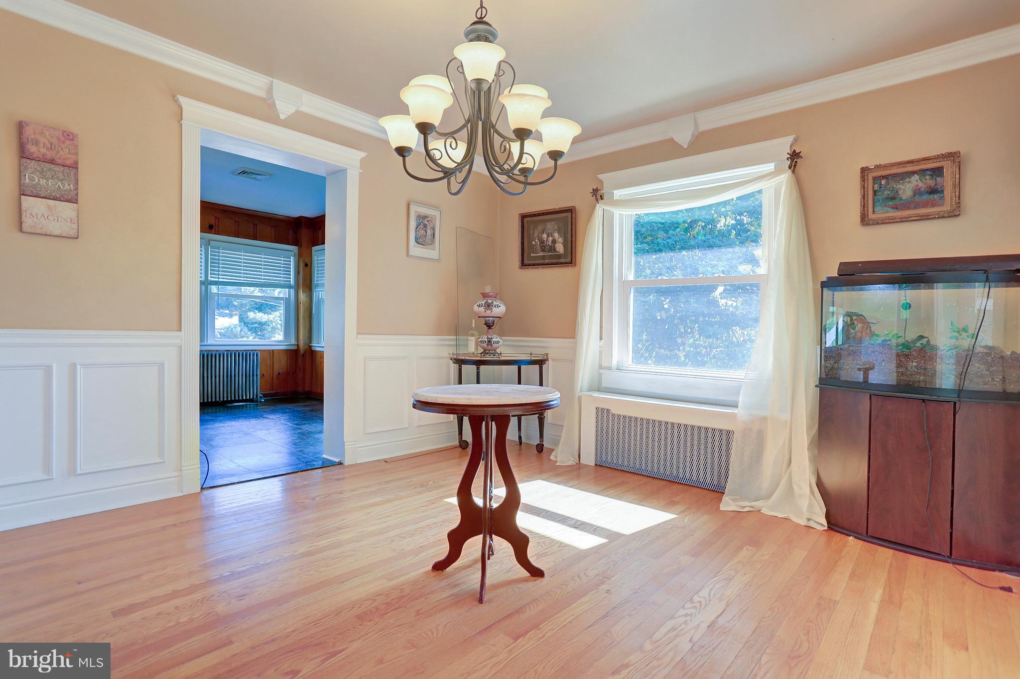 425 Corbin Road York, PA 17403 - Photo 5 of 49 a view of a livingroom with furniture wooden floor chandelier and windows