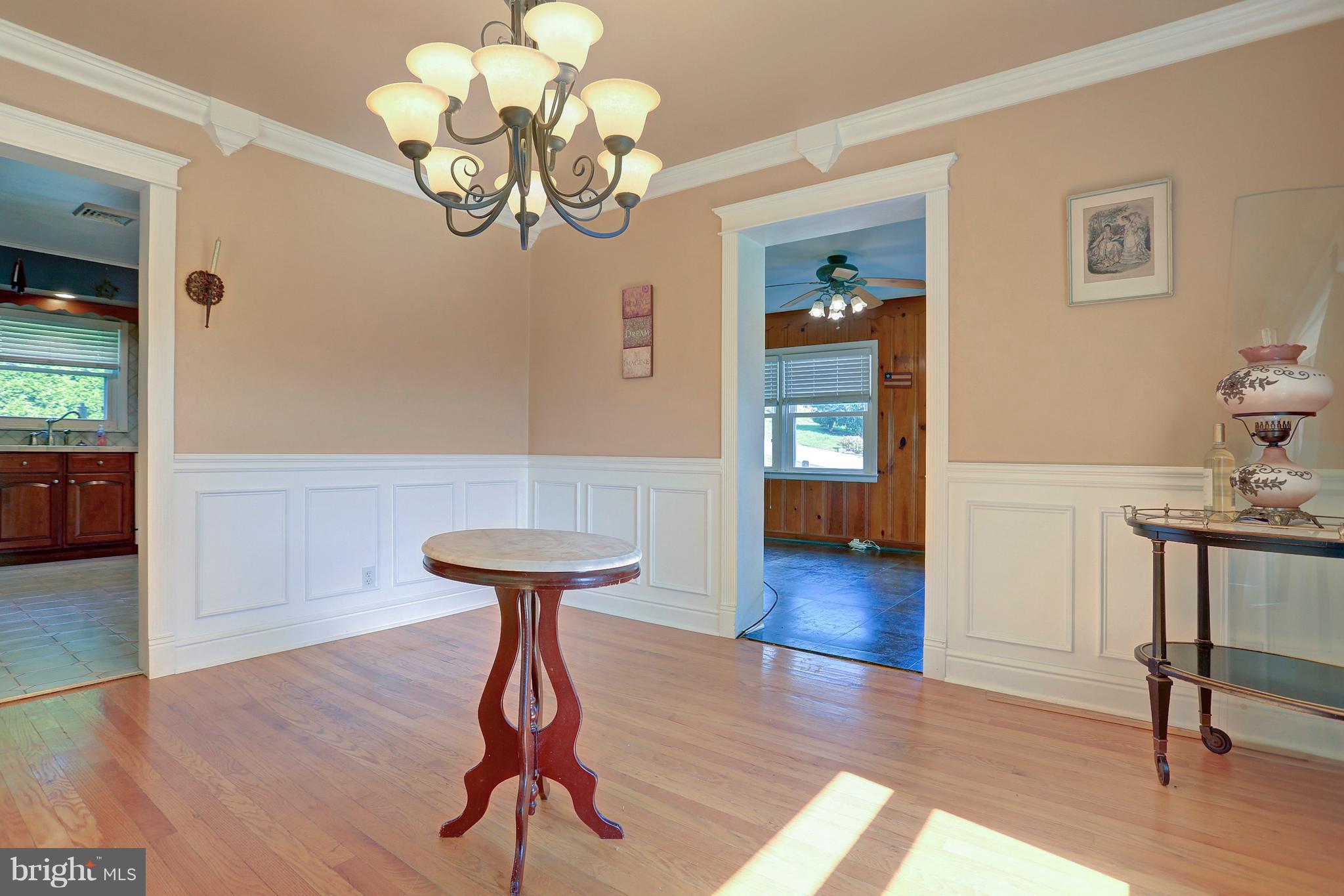 425 Corbin Road York, PA 17403 - Photo 6 of 49 a view of a livingroom with wooden floor and a chandelier